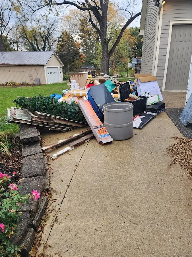 Dumpster being loaded with debris for Residential Dumpster Rental in Apopka